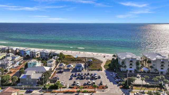 birds eye view of property with a residential view, a water view, and a beach view