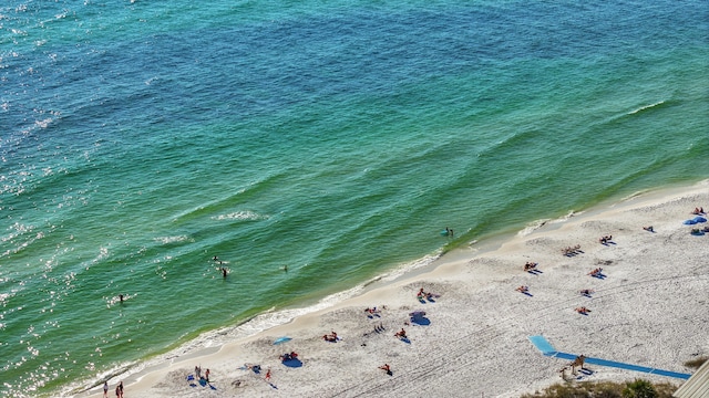 drone / aerial view with a beach view and a water view