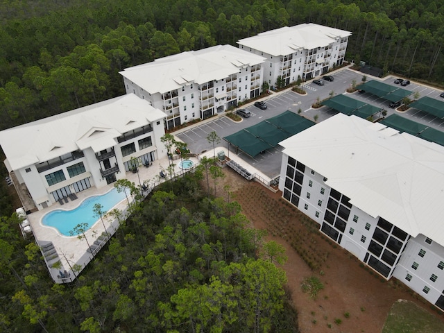 drone / aerial view featuring a view of trees