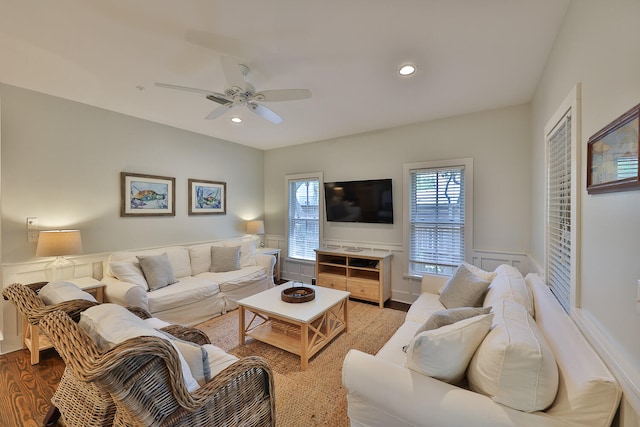 living room featuring hardwood / wood-style flooring and ceiling fan