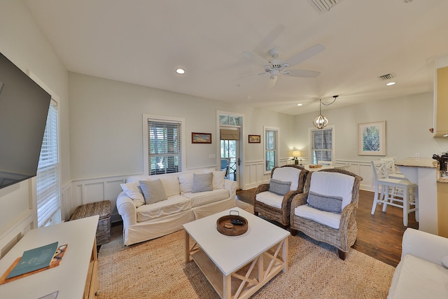 living room with ceiling fan and hardwood / wood-style floors