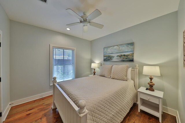 bedroom featuring dark hardwood / wood-style floors and ceiling fan