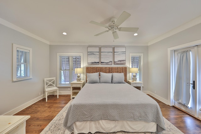 bedroom featuring ornamental molding, dark wood-type flooring, multiple windows, and ceiling fan