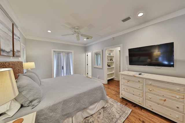 bedroom featuring crown molding, ceiling fan, and dark hardwood / wood-style flooring