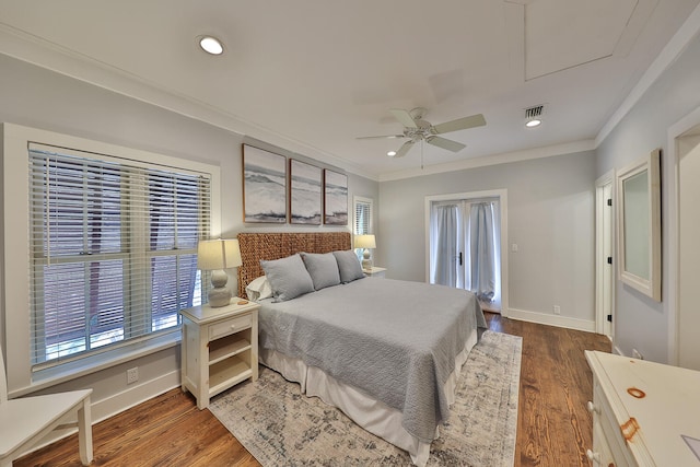 bedroom featuring ornamental molding, ceiling fan, and dark hardwood / wood-style flooring