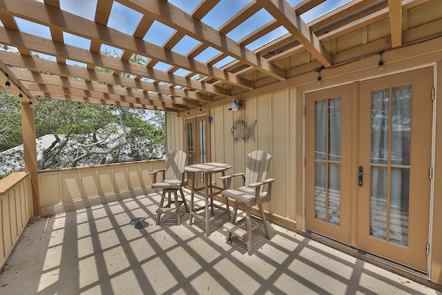 view of patio / terrace with a pergola and french doors