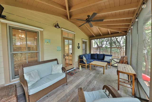 sunroom featuring wooden ceiling, lofted ceiling with beams, and ceiling fan