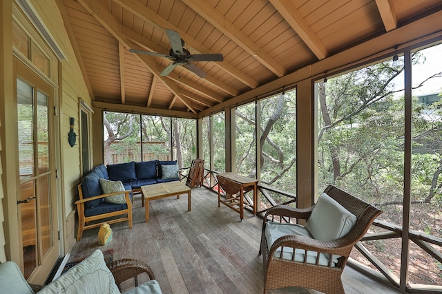 sunroom featuring ceiling fan, lofted ceiling with beams, and wood ceiling