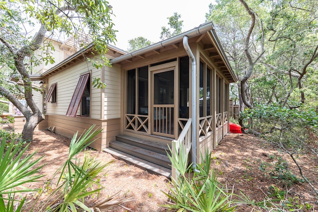 exterior space featuring a sunroom