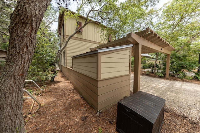 view of property exterior featuring a storage shed