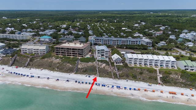 drone / aerial view with a beach view and a water view