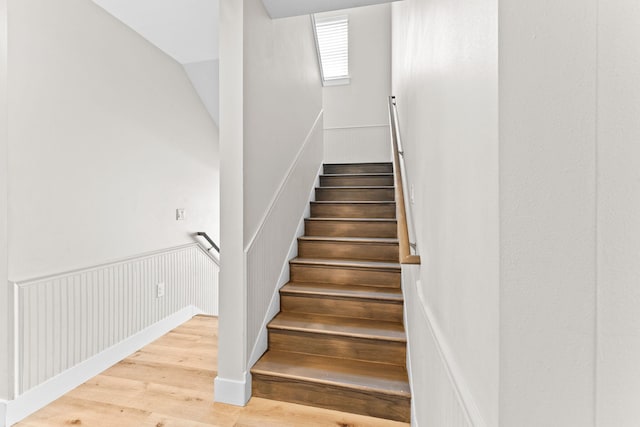 staircase featuring light hardwood / wood-style floors