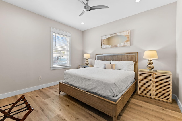 bedroom with ceiling fan and hardwood / wood-style flooring