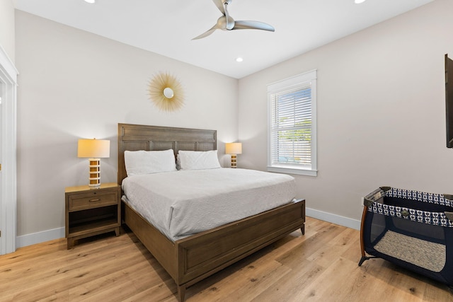 bedroom featuring ceiling fan and light hardwood / wood-style floors