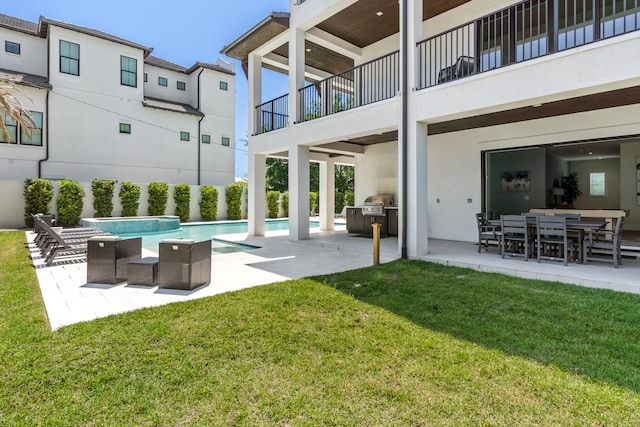 view of yard featuring an outdoor living space, a patio area, a balcony, and a fenced in pool