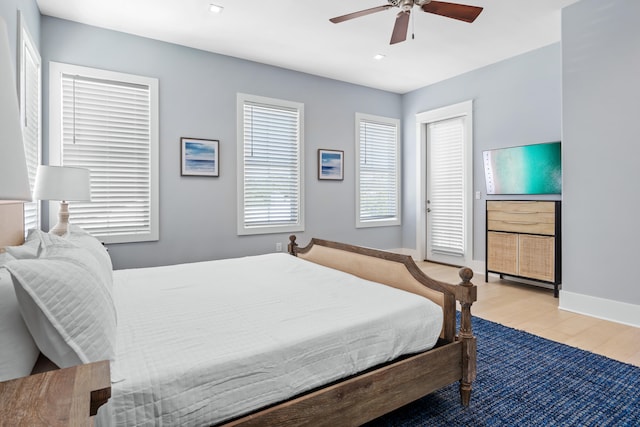 bedroom with hardwood / wood-style floors and ceiling fan