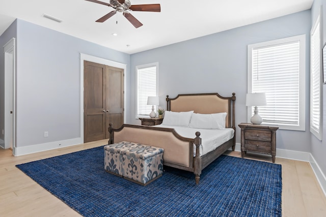 bedroom featuring wood-type flooring and ceiling fan