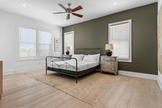 bedroom featuring ceiling fan and light wood-type flooring