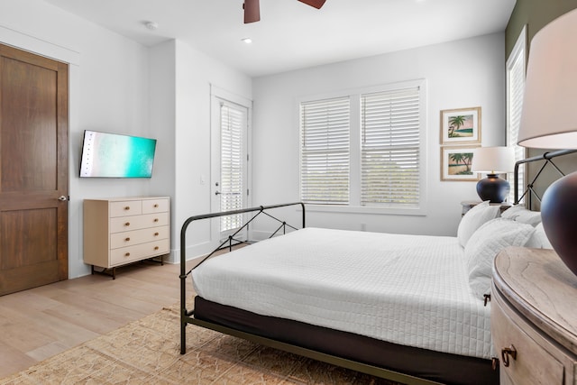 bedroom featuring ceiling fan and light hardwood / wood-style flooring