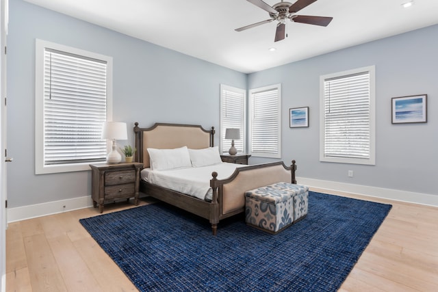 bedroom featuring ceiling fan and light hardwood / wood-style floors