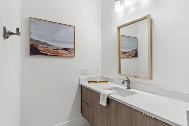 bathroom featuring vanity with extensive cabinet space