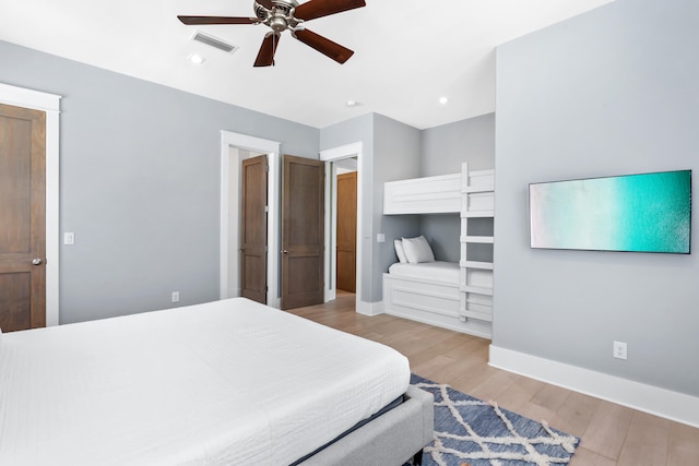 bedroom featuring wood-type flooring and ceiling fan