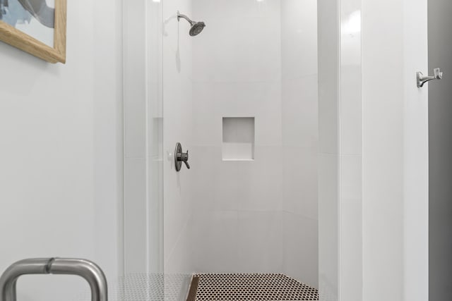 bathroom with tiled shower