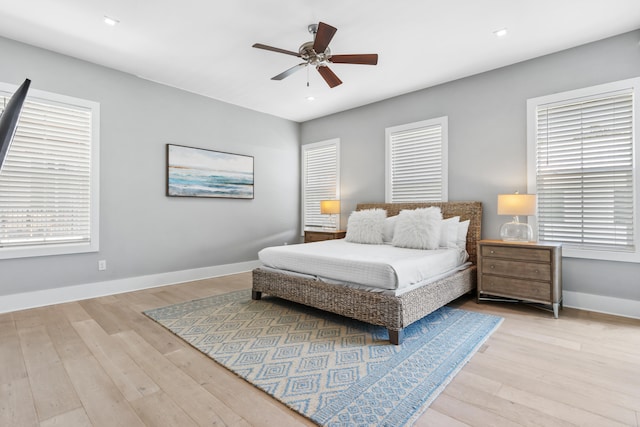 bedroom featuring ceiling fan and light hardwood / wood-style flooring