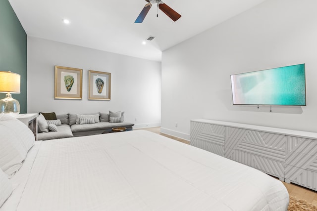 bedroom with ceiling fan and light hardwood / wood-style flooring