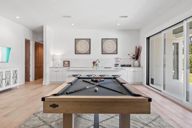 rec room with light wood-type flooring and billiards