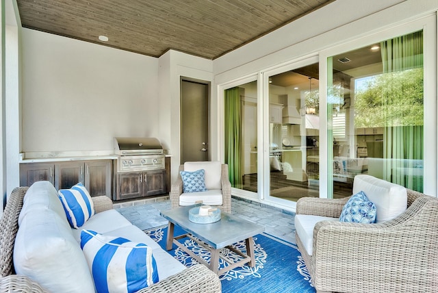 view of patio with french doors, exterior kitchen, and grilling area