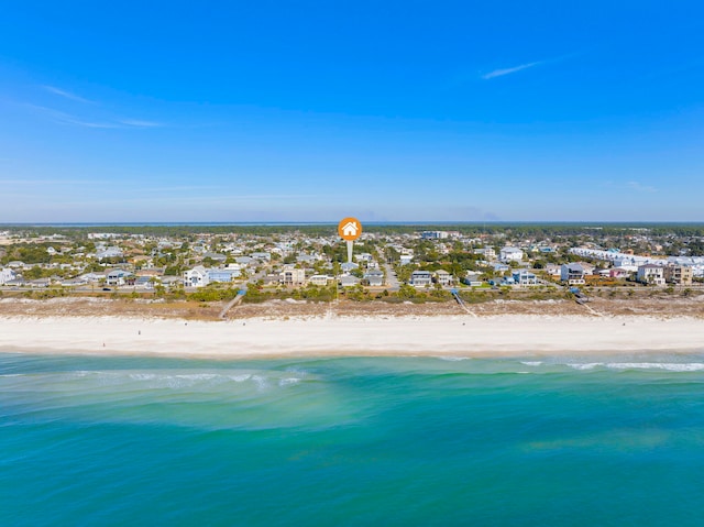 drone / aerial view featuring a beach view and a water view