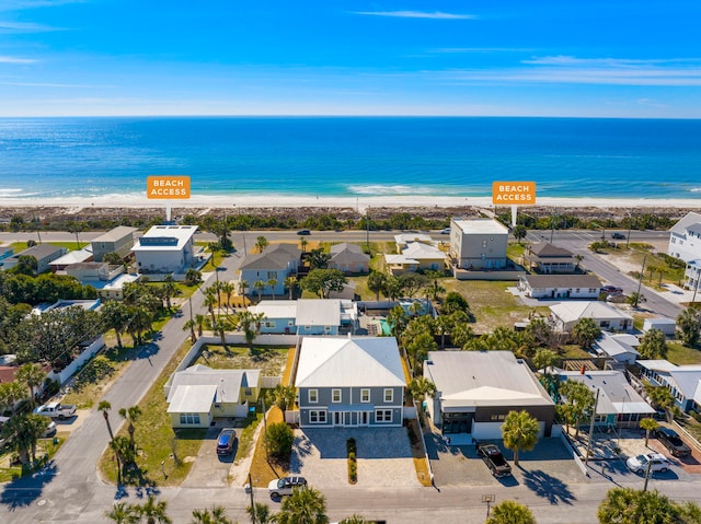 bird's eye view featuring a view of the beach and a water view