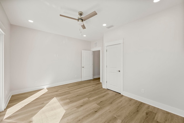 unfurnished bedroom with ceiling fan and light hardwood / wood-style floors