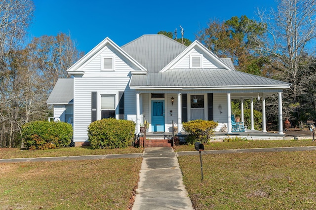 view of front of house featuring a front lawn and covered porch