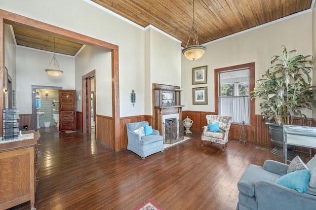 interior space featuring dark hardwood / wood-style floors, wooden ceiling, and crown molding