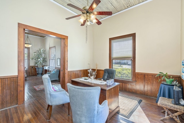 office space featuring ceiling fan, wood ceiling, crown molding, and dark wood-type flooring