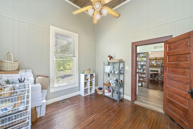 misc room with ceiling fan and dark hardwood / wood-style flooring