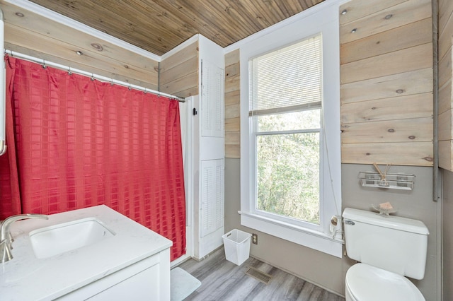 bathroom with vanity, hardwood / wood-style flooring, toilet, ornamental molding, and wood ceiling