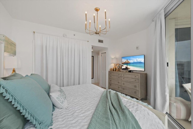 bedroom featuring a chandelier