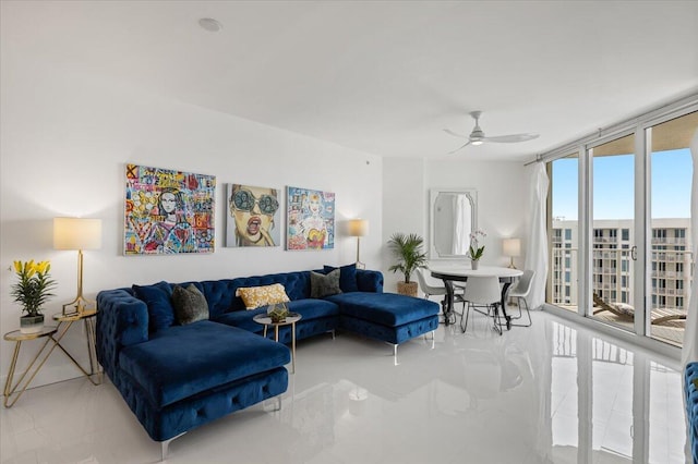 living room featuring a wall of windows and ceiling fan