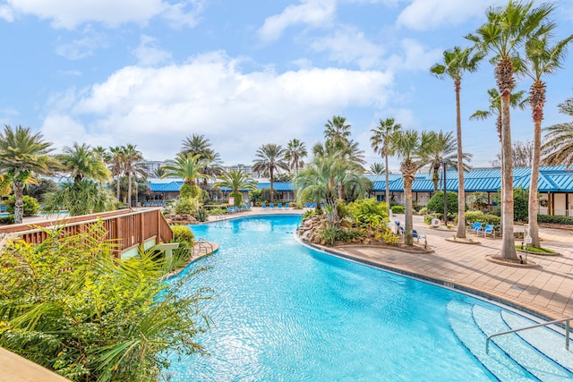 view of swimming pool with a patio area