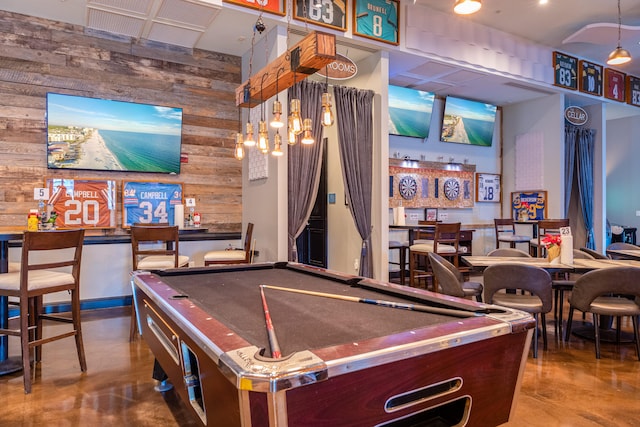 playroom featuring billiards, concrete floors, and wood walls