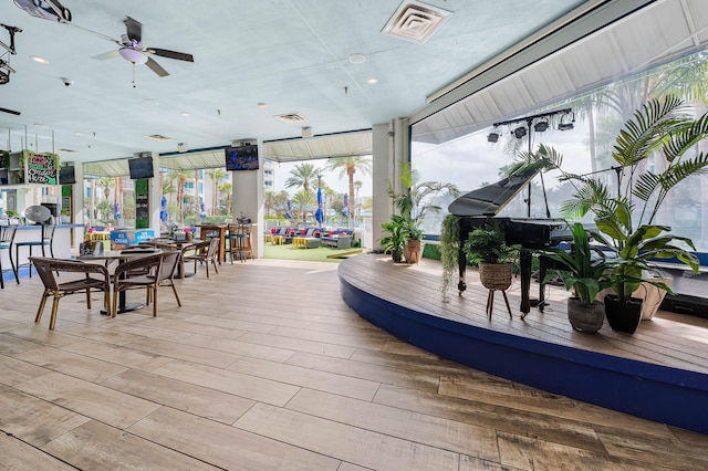 wooden terrace featuring ceiling fan