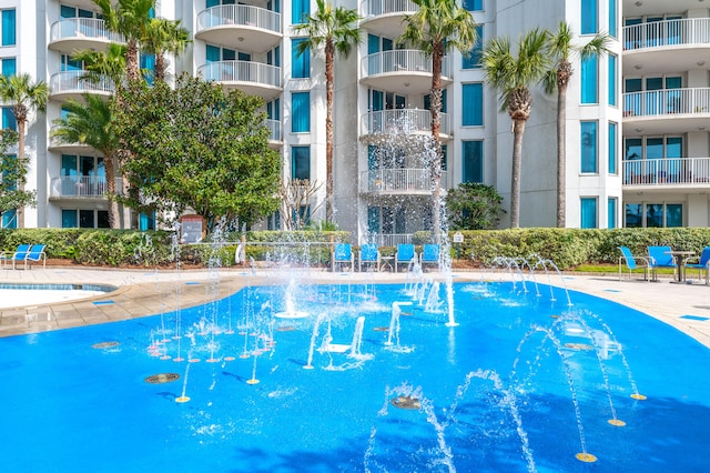 view of pool with pool water feature