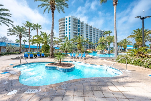 view of swimming pool featuring a patio area