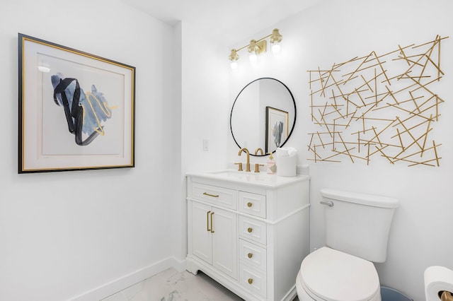 bathroom featuring toilet and vanity