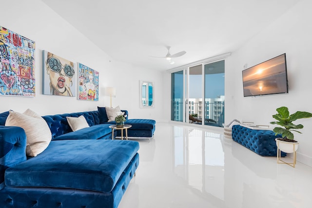 living room featuring floor to ceiling windows and ceiling fan