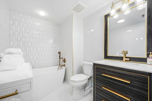 bathroom with vanity, toilet, and a tub to relax in