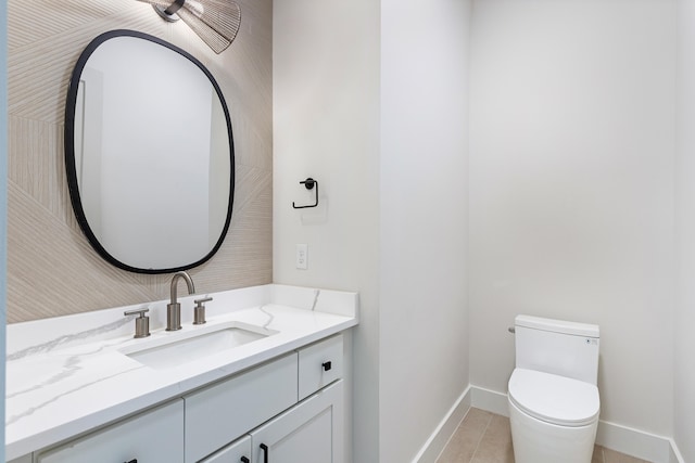 bathroom featuring toilet and vanity